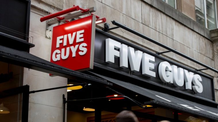 How much does a five guys make a year?