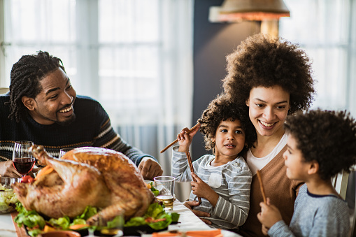 What do black families cook for Thanksgiving?