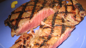 What does Golden Corral season their steaks with?