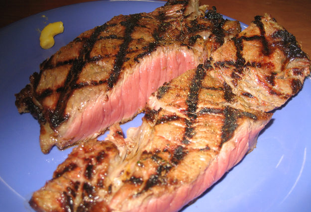 What does Golden Corral season their steaks with?