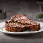 What does Ruth Chris put on their steaks?