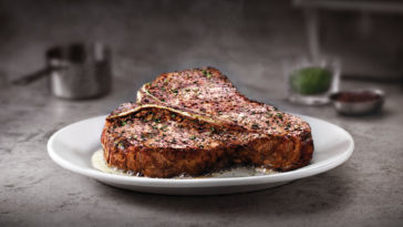 What does Ruth Chris put on their steaks?