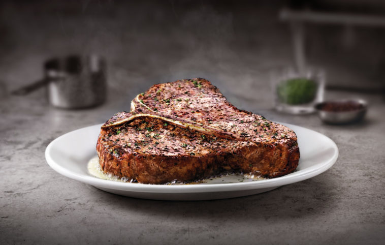 What does Ruth Chris put on their steaks?