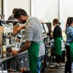 Can Starbucks employees wear pins?