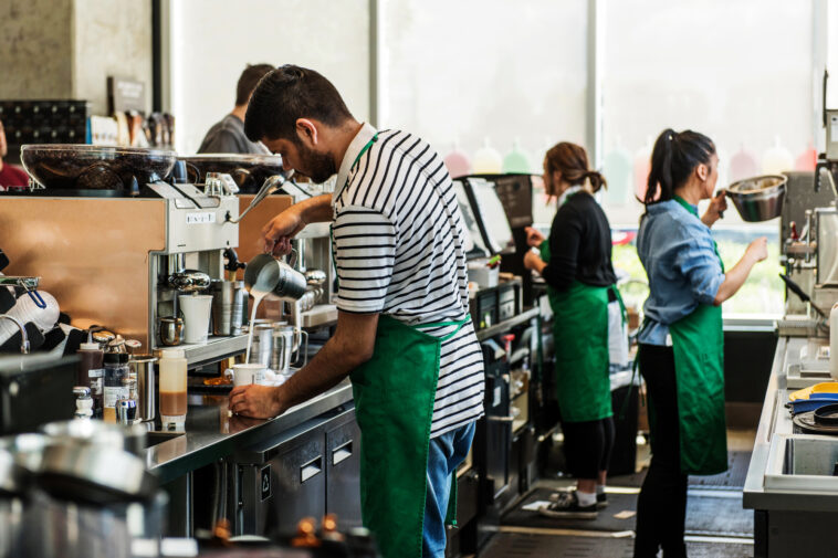 Can Starbucks employees wear pins?