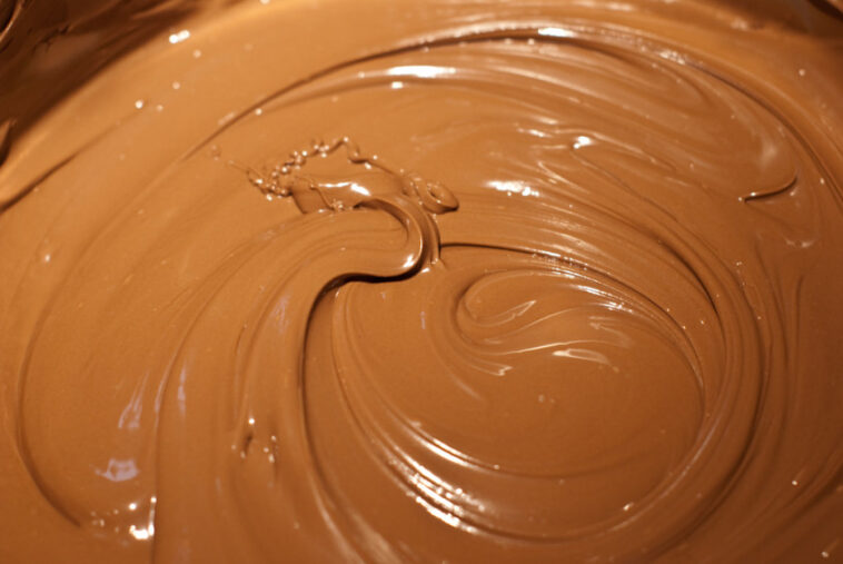 Can you add milk to melted chocolate to thin it out?