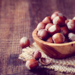 How do you add hazelnut flavor to coffee beans?