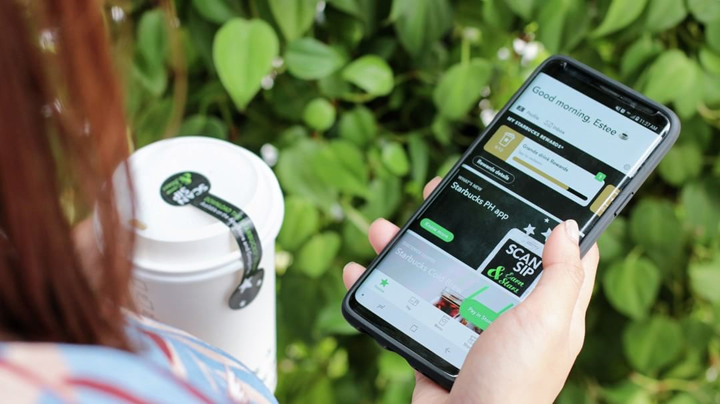 How do you pay with the Starbucks app?