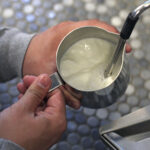 How do you steam milk for a latte?