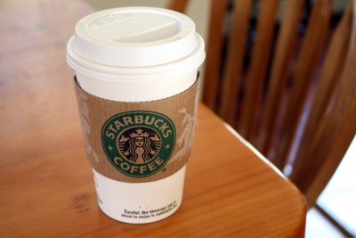 How many calories are in a grande iced vanilla latte with almond milk?