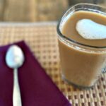 How many calories are in an iced apple crisp macchiato with almond milk?