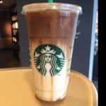 How many calories is in a venti caramel macchiato with almond milk?