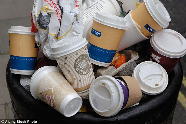 How many paper coffee cups are thrown away?