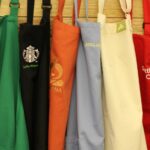 What does a red apron at Starbucks mean?