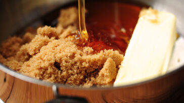 What does adding butter to caramel do?