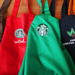 What does the red Starbucks apron mean?