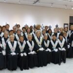 What is the feminine of grand in French?