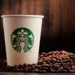 Where do Starbucks buy their coffee beans?
