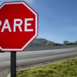 Why do Spanish stop signs say alto?