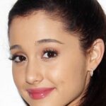 Why is Ariana's last name Grande?