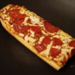 Why is pizza feminine in French?