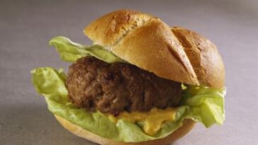 Do I need to defrost frozen burgers before grilling?