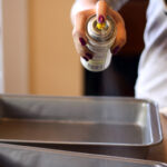 Do I spray the pan when baking cookies?