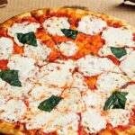 How do I reheat pizza to make it taste better?