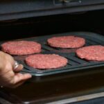 How do you broil burgers in the oven?