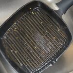 How do you clean a cast iron grill pan?