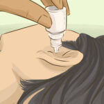 How do you drain fluid from your middle ear at home?