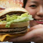 How do you eat a Mac burger?