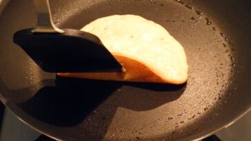 How do you flip a pancake?
