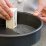 How do you grease a pan?