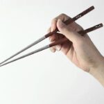 How do you hold chopsticks correctly?