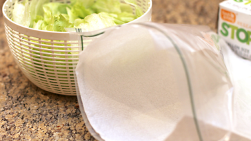 How do you keep bagged shredded lettuce fresh after opening?
