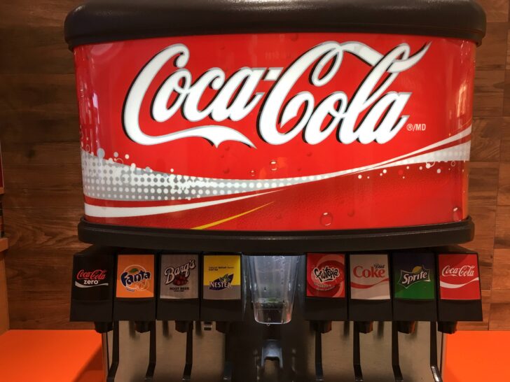 How do you refill a Coke machine?