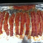 How do you reheat cooked bacon?