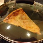 How do you reheat pizza so it's crispy?