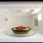 How long can a microwave run with food?