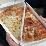 How many calories are in a slice of Hungry Howie's pepperoni pizza?