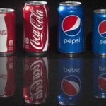 How many soda cans are sold each year?