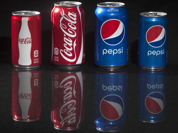 How many soda cans are sold each year?