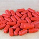 How much OJ should I take with iron?