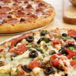 How much is a large Domino's veggie pizza?