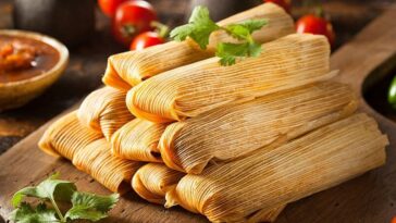 How should I store and reheat tamales?