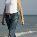 Is it better to walk on the beach with or without shoes?