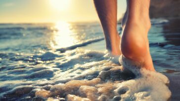 What are the benefits of walking on the beach?