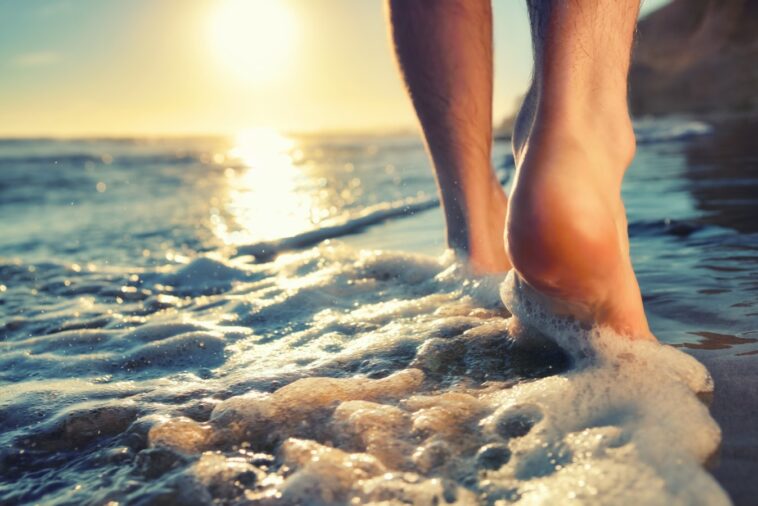 What are the benefits of walking on the beach?