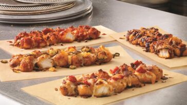 What comes on Domino's specialty chicken?